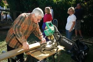 Pictured is Frank Urso, Chairperson of the 2006 LIBOR Public<br>Relations Committee, working alongside the Rebuilding Together LI<br>team to help build the ramp that Angel DiGiovanni needed<br>in order to leave the house so she could receive medical attention.

