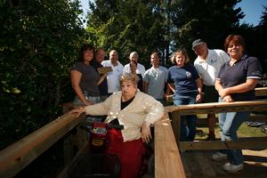During a recent October morning, LIBOR Realtor members<br> donated their time to work alongside the Rebuilding Together LI<br> team to build a wheelchair ramp so Angel DiGiovanni is able to<br> receive the medical attention that she needs.  Pictured here<br> are members of LIBOR and Rebuilding Together LI with Angel<br> DiGiovanni as she leaves her home for the first time in weeks.

