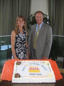 Former Congressman Michael Oxley celebrates the fifth anniversary of Sarbanes-Oxley by accepting a cake from Approva executive, Julie Bacon.