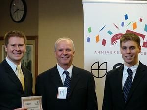 Tony Shipley presents the Second Runner-Up Queen City Angels First Fund Award to Justin Chafe and Andrew 
Vincent of Indiana University

Business Plan:  Adora Interactive Corporation
Concept Focus:  Integrated e-commerce and social networking
