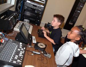 Children learning the ins and outs of WIN's audio and visual operations during the 2006 Take Your Daughters and Sons to Work