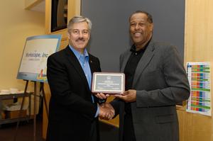 Warm2Kids M.L. Carr presenting Workscape's CEO Tim Clifford with an Exemplary Role Model award.