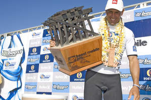 Boost Mobile team rider and 8 time World Champion Kelly Slater poses with trophy after winning the 2007 Boost Mobile Pro of Surf presented by Hurley. Photo credit Boost Mobile/Grant Ellis