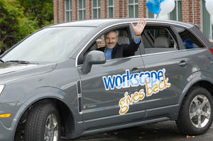 Photo caption: Workscape President and CEO Tim Clifford driving the Saturn VUE from company's Marlborough, Mass. headquarters to the next stop in the Workscape Gives Back road trip.