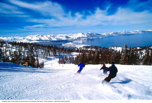 Skiing down the slopes at Heavenly Mountain Resort, overlooking Lake Tahoe, Nevada.