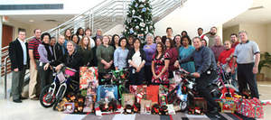 Wellness International Network employees gave clothing, shoes, toys and bikes to the Dallas Children's Advocacy Center, brightening the holidays for 35 local children.