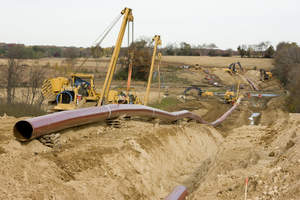 Tying in pipe during construction of Southern Access, Stage 2, Spread 1 in Rock County, Wis. (east of Beloit).

 

