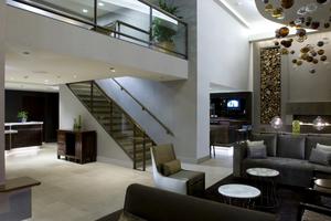 At the new eco-friendly Hotel Felix Chicago, a dynamic 2-story lobby is finished with comfortable lounge furnishings, and a palette of warm neutrals in natural textures inviting to the touch.  A cozy bar, contemporary art and a property-wide design inspired by nature infuse the downtown hotel with style.