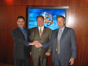 (L to R) Matt Moore, AT & T; Kevin Uhlich, Kansas City Royals; and David Holland, Cisco Systems shake hands after completing a tour of the new technological features at Kauffman Stadium.