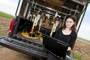Karen Kosiba of the Center for Severe Weather Research uses a Lenovo ThinkPad laptop to transfer data collected by dozens of weather pods that are placed in the path of storms to measure variables such as wind speed and temperature.