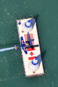 Pilot Peter Besenyei of Hungary flies through an air gate during the Red Bull Air Race over the Detroit River in 2008.