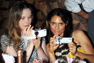 Actresses Julia Delpy and Emily Wagner using their DXG-Riviera camcorders from the Luxe Collection  Photo by: Michael Kovac
