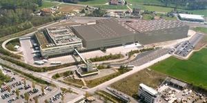 The picture above is a rendering of the future Migros distribution center in Suhr. The storage area required for the OPM technology will be erected on the roof of the existing building (photo Migros).