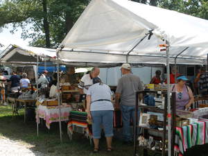 Shoppers look through sale items at the World's Longest Yard Sale.