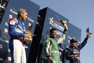 American Michael Goulian celebrates his first-ever Red Bull Air Race World Championship win in Budapest, Hungary on August 20 alongside Paul Bonhomme, second place, and fellow American, Kirby Chambliss, third place.