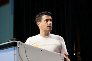 YourVersion CEO Dan Olsen on stage at TechCrunch50 Conference after winning People's Choice Award