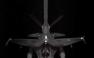 The advanced Aerial Refueling Boom System on the A330 MRTT performs a night refueling of an F-16 receiver aircraft, as seen through the refueling operator's 3-D enhanced vision system with laser infrared lighting and high-definition digital stereoscopic viewing.