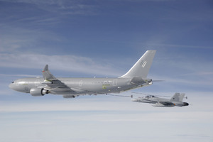 An F/A-18 receiver aircraft closes on a refueling drogue trailed from one of the A330 Multi-Role Tanker Transport's digital hose-and-drogue refueling pods. 