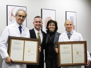State Representative Dwayne Bohac (R-Houston) and his wife, Dawn, honored Dr. Raymond Sawaya (left) and Dr. Ralph Zinner at the University of Texas Health Science Center/MD Anderson Cancer Center for Lung Cancer Awareness Month in Texas.
