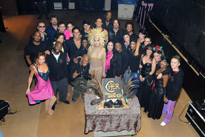 Cher poses with her cast and crew before their 100th performance at The Colosseum at Caesars Palace in Las Vegas