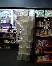Noted artist and Scotch Off The Roll Tape Sculpture Contest judge, Jesse Nolan, used Scotch Packaging Tape to create a sculpture depicting a woman climbing shelves.