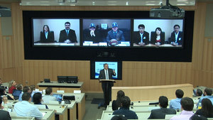 Duke University's virtual lecture hall using Cisco TelePresence.  Blair Shepphard, dean of Fuqua School of Business, presides over more than 100 students with John Chambers, chairman and CEO, Cisco, and John Doerr, partner, Kleiner Perkins Caufield & Byers presenting from San Jose, Calif., Tony O'Driscoll, Duke University professor and several students joining from New Delhi, India.