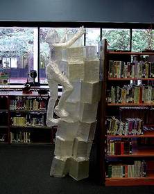 Noted artist and Scotch Off The Roll Tape Sculpture Contest judge, Jesse Nolan, used Scotch Packaging Tape to create a sculpture depicting a woman climbing shelves.       