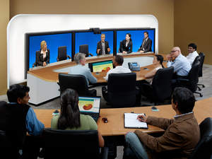 Meeting participants collaborate using the Cisco TelePresence System 3200 and the TANDBERG Telepresence T3

