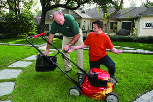 Kirk Hurto, Ph.D., vice president of technical services, TruGreen, helps demonstrate sustainable lawn care tips