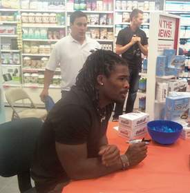 Carolina Panthers' star running back DeAngelo Williams answers questions and signs autographs at GNC in the SouthPark Mall while promoting ISS Research's OhYeah!(R).