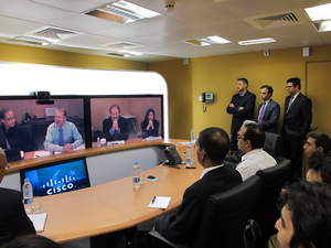 Cisco Chairman and CEO John Chambers and Paul Mountford, president of Cisco Emerging Markets, meeting Cisco Pakistan employees via TelePresence