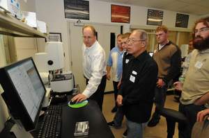 Dr. John Ireland, Director of the NanoProfessor Nanoscience Education Program, demonstrates the hands-on nature of NanoInk's NLP 2000 to College of Lake County and Harper College students.
