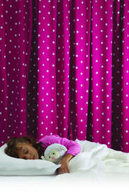 Blackout curtains, such as those made by LightCatcher, can help turn the bedroom into the sleep sanctuary children need.  