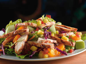 Paradise Chicken Salad (Weight Watchers PointsPlus value: 8): An island blend of pineapple, mandarin oranges, fresh apple chunks, pico de gallo and crisp greens, topped with slices of blackened grilled chicken and served with a cool balsamic vinaigrette.