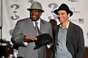 Cedric the Entertainer shows off his WHO CED? hat line with Dun & Bradstreet Credibility Corp. CEO Jeff Stibel in Las Vegas, NV. 