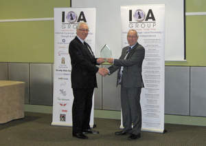 JCM Global's Vega-RC bill validator is named the 'Most Innovative Product of 2010.' JCM UK Branch Sales Director David Morosoli accepts the award from John Powell, Joint Secretary of the Independent Operators Association and Managing Director of IOA member company, S E Leisure.