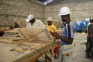 PermaShelter Factory Employees Build T-Shelters
