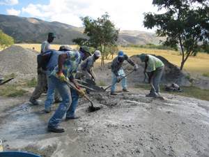 Cement mixing, on the ground, in Haiti