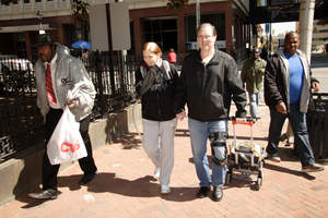 Margaret Daugherty walks around Richmond with her husband Brian Younglove using the Freedom(R) portable driver to power her Total Artificial Heart. She is participating in the FDA-approved IDE clinical study of the Freedom portable driver.
