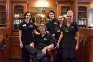 Pictured together in one of Roosters MGC's custom-made barber stations are Parker store team members, from left, Brandi Shapiro, Chantel Robinson, Jesse Shapiro, Angelo Le, Autumn Cooley and Christine Johnson.
