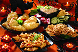 From upper left: Chicken Pastelitos, Devil's Dip, Great Balls of Fire and Curry Chicken Stars