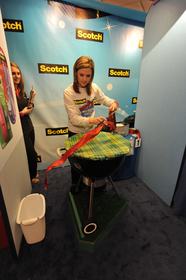 Kristen Dolle competes in the Scotch Brand Most Gifted Wrapper Contest, sponsored by 3M.