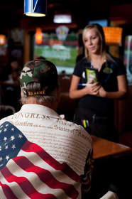 A veteran orders a free meal at Applebee's, which will provide free Thank You meals to veterans and active duty military on Veterans Day for the third consecutive year.