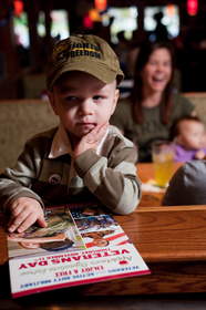 Decisions, decisions, decisions. A child contemplates all of the delicious selections on the Applebee's Veterans Day menu. Applebee's will salute veterans and active duty military with a free meal on Veterans Day.