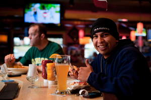 A Marine enjoys a free Thank You meal at Applebee's on Veterans Day.