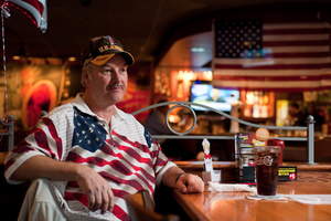 A veteran awaits his free Thank You meal at Applebee's on Veterans Day.