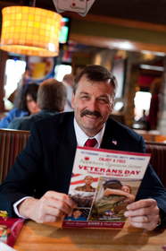 A veteran reviews the menu at Applebee's, where all veterans and active duty military are honored with a free Thank You meal.