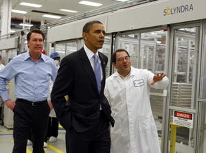 FREMONT, CA - MAY 26: Ben Bierman (R) and Chris Gronet (L) lead U.S. President Barack Obama on a tour of the Solyndra solar panel company May 26, 2010 in Fremont, California. President Obama toured Solyndra Inc., a growing solar power equipment facility that is adding jobs as they expand their operation. (Photo by Paul Chinn-Pool/Getty Images)