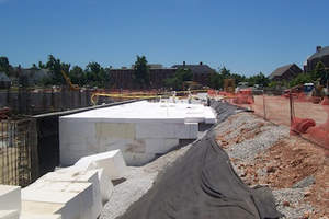 
ACH Foam's Geofoam completely eliminates lateral pressure against a vertical structure when used as backfill, whether it is a bridge abutment, retaining wall, or foundation wall.