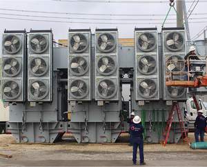 Efacec is providing new services and products to utilities and industries that use electrical transformers. Shown here -- installation of Efacec's 'disassociated phase' power transformer.